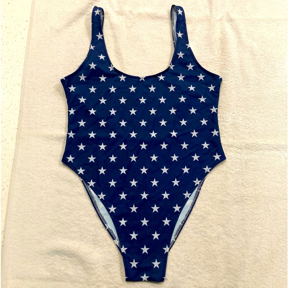 NWOT one piece, low back, sexy bathing suit. Fits like a medium